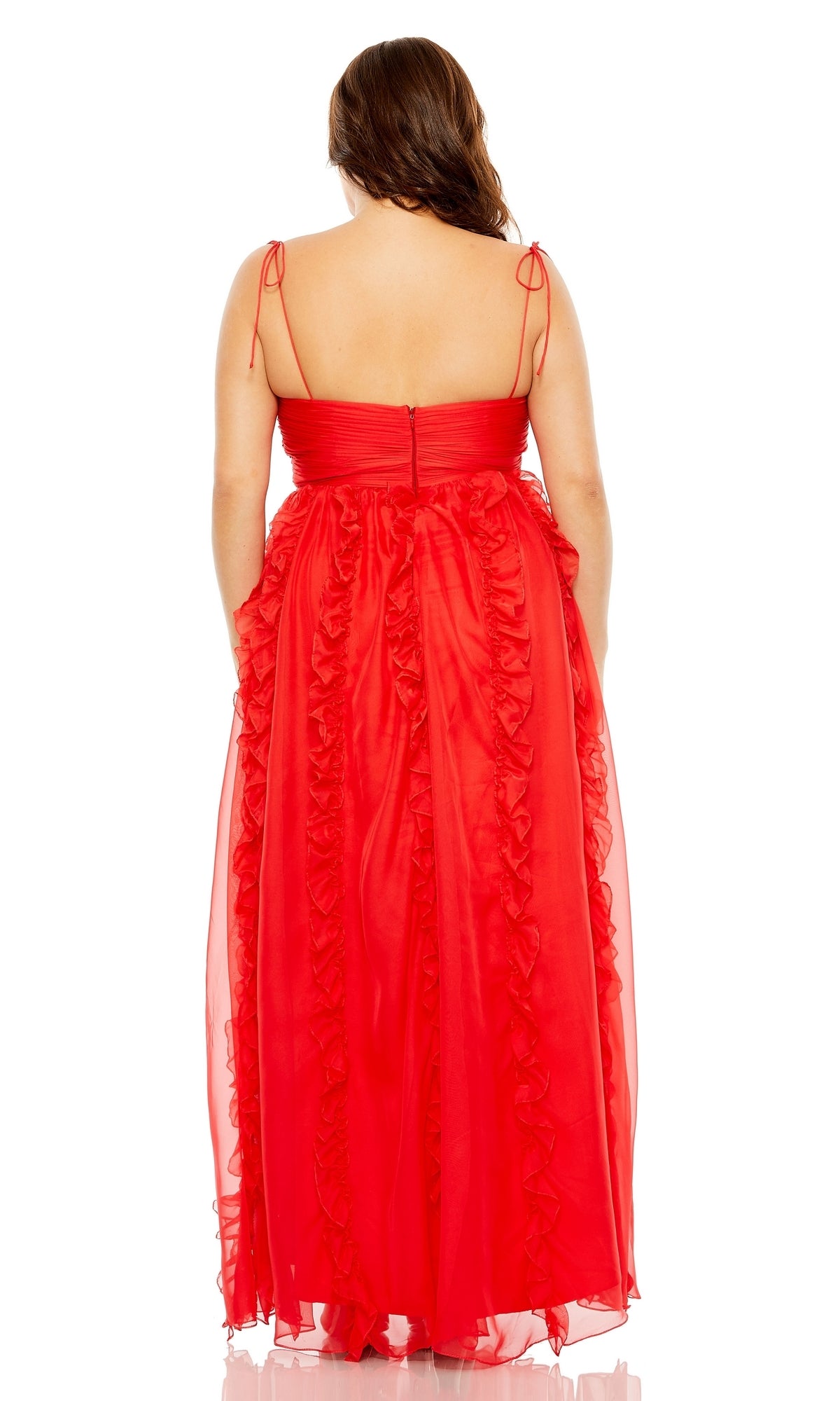 A woman with long brown hair is shown from the back wearing the Mac Duggal 68543 Plus-Size Ruffle Formal Dress, a sleeveless, floor-length red gown with elegant ruffles and a zip closure.